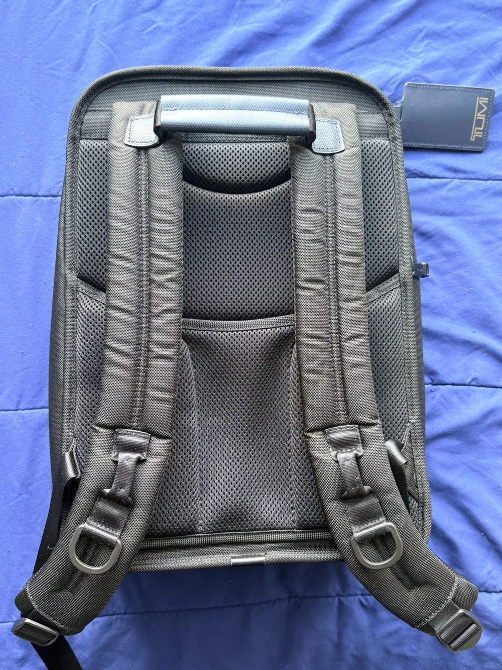 Tumi Black Bag with Red Limited-Edition Tag